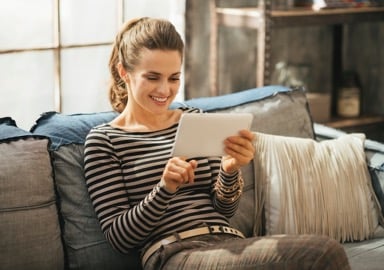 woman at home with ipad